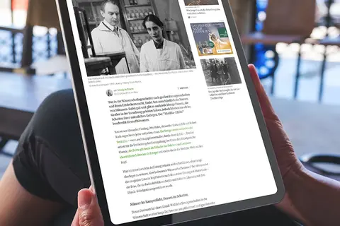 Aufsicht auf ein Tablet mit der Website zum Thema Matilda-Effekt, dass eine junge Frau in den Händen hält