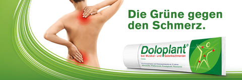 Frau mit Muskel- und Gelenkschmerzen reibt sich den Rücken ein. Daneben ist die Headline "Die Grüne gegen den Schmerz" und eine Doloplant® -Tube abgebildet.